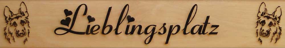 Schriftzug „Lieblingsplatz“, mit zwei stilisierte Hundeköpfe Schriftzug „Lieblingsplatz“, mit zwei stilisierte Hundeköpfe